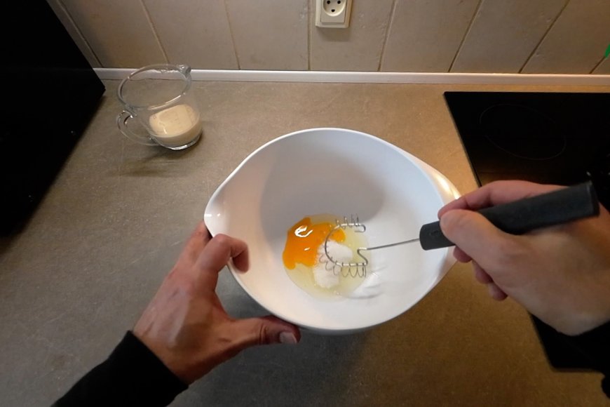 Whisk in sugar and eggs