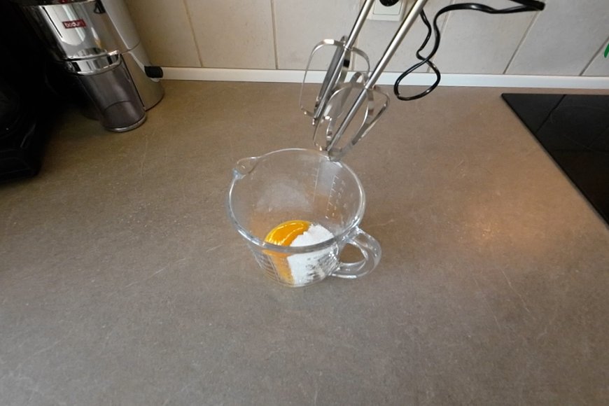 Add egg yolk and sugar